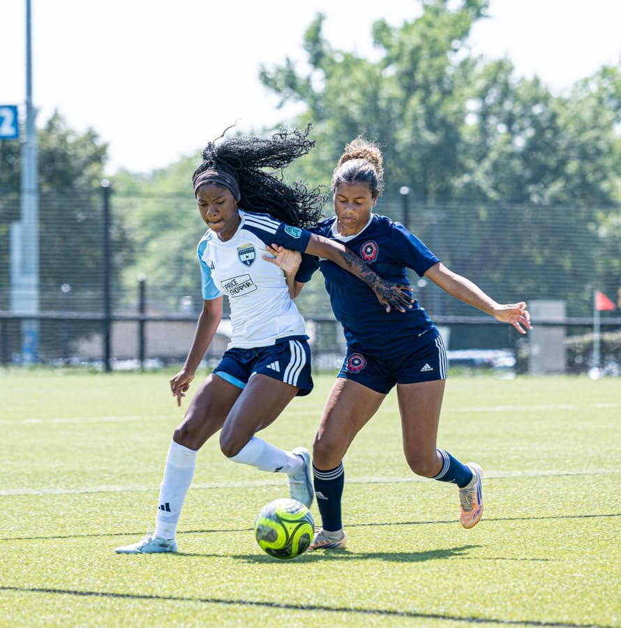 An SBV ECNL Girls player dribbling through pressure
