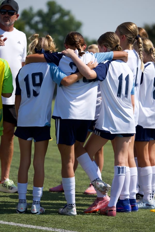 An SBV team huddled together