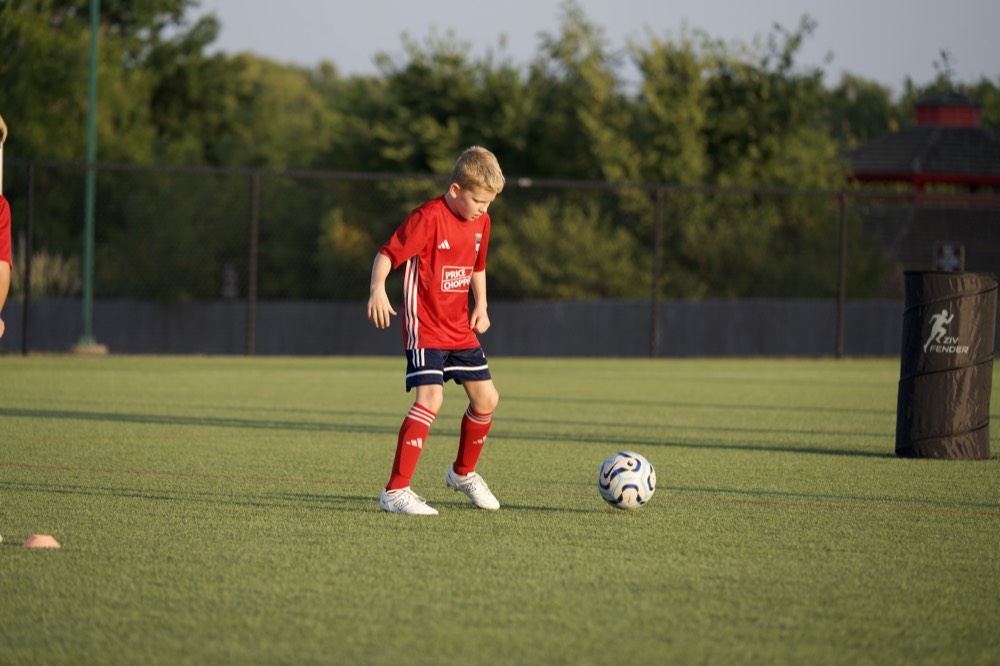 An SBV player dribbling at training